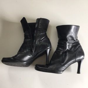 Black boots well worn with a new life waiting for them.